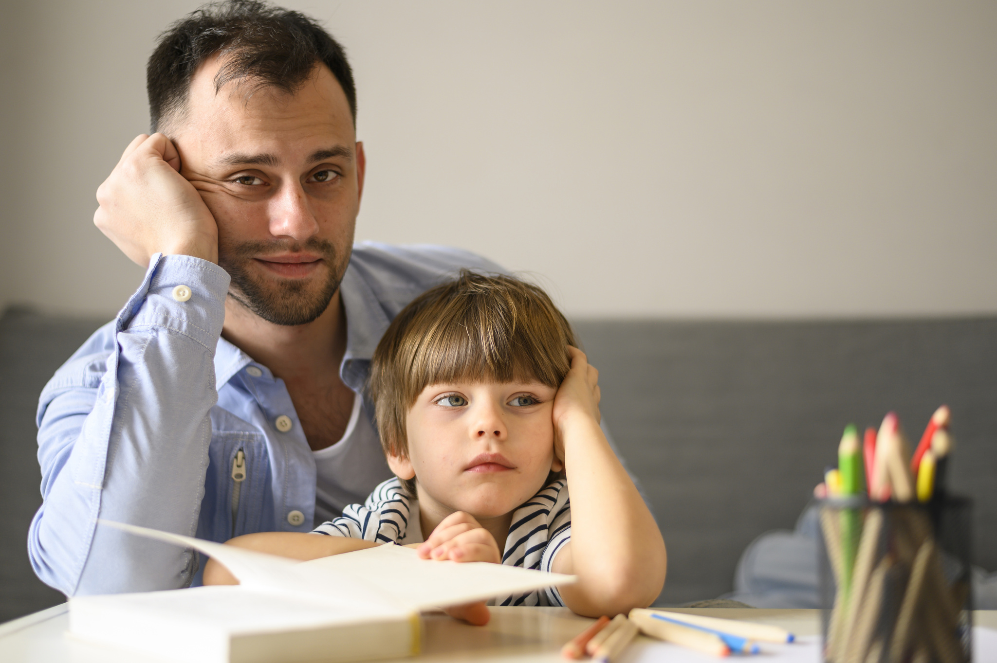 father-son-posing-with-book.jpg