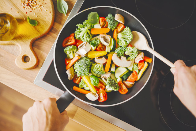 man-cooking-fresh-vegetables-pan.jpg