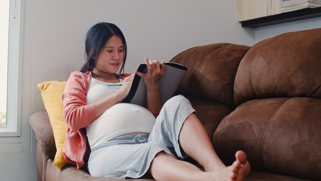 young-asian-pregnant-woman-drawing-baby-belly-notebook-mom-feeling-happy-smiling-positive-peaceful-while-take-care-child-lying-s