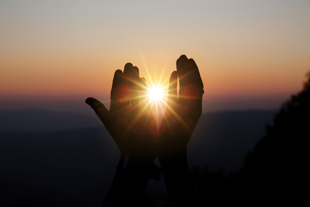 spiritual-prayer-hands-sun-shine-with-blurred-beautiful-sunset.jpg