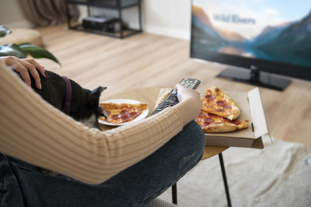 woman-eating-pizza-watching-tv.jpg
