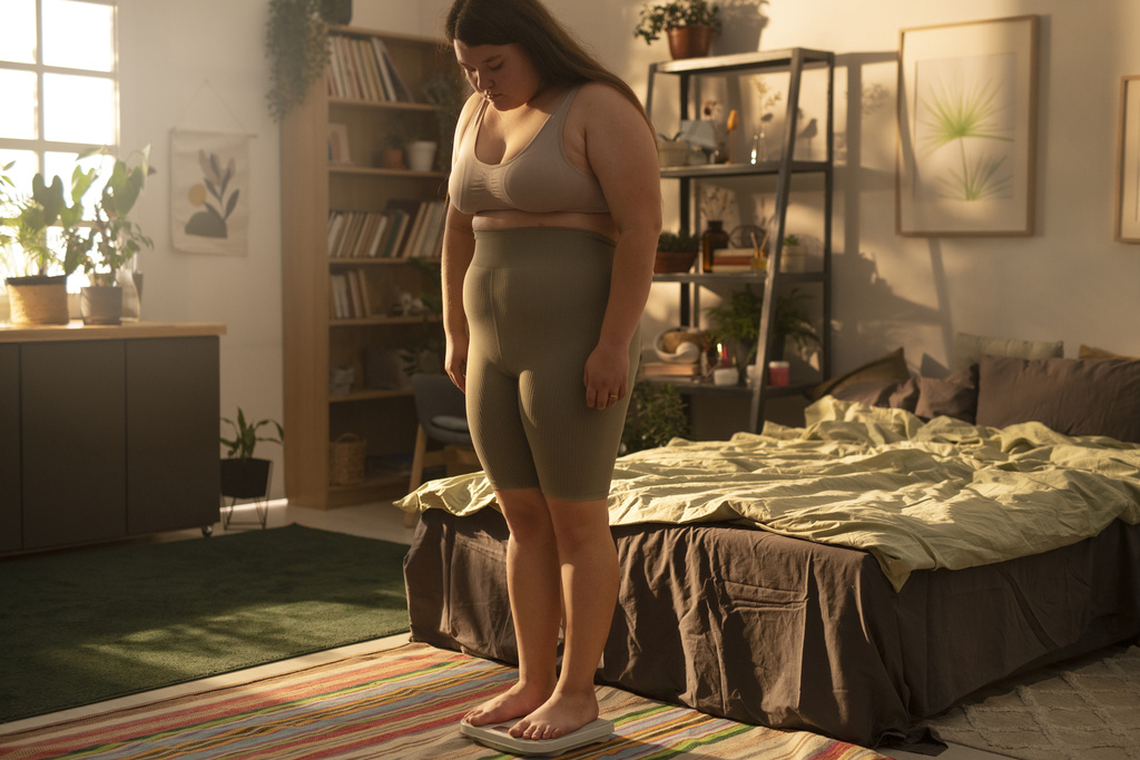 side-view-plus-sized-woman-scale.jpg