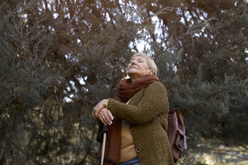 senior-woman-enjoying-hike-nature.jpg