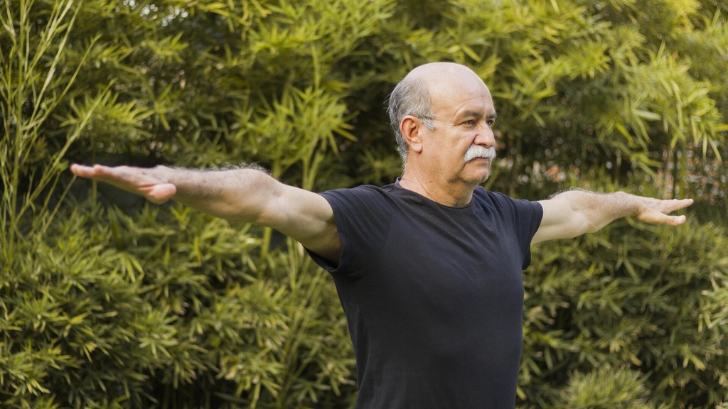 medium-shot-man-stretching-his-arms.jpg