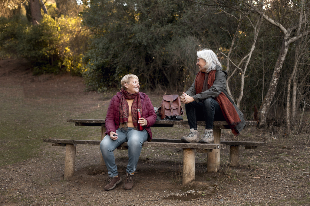 two-senior-female-friends-enjoying-hike-nature.jpg
